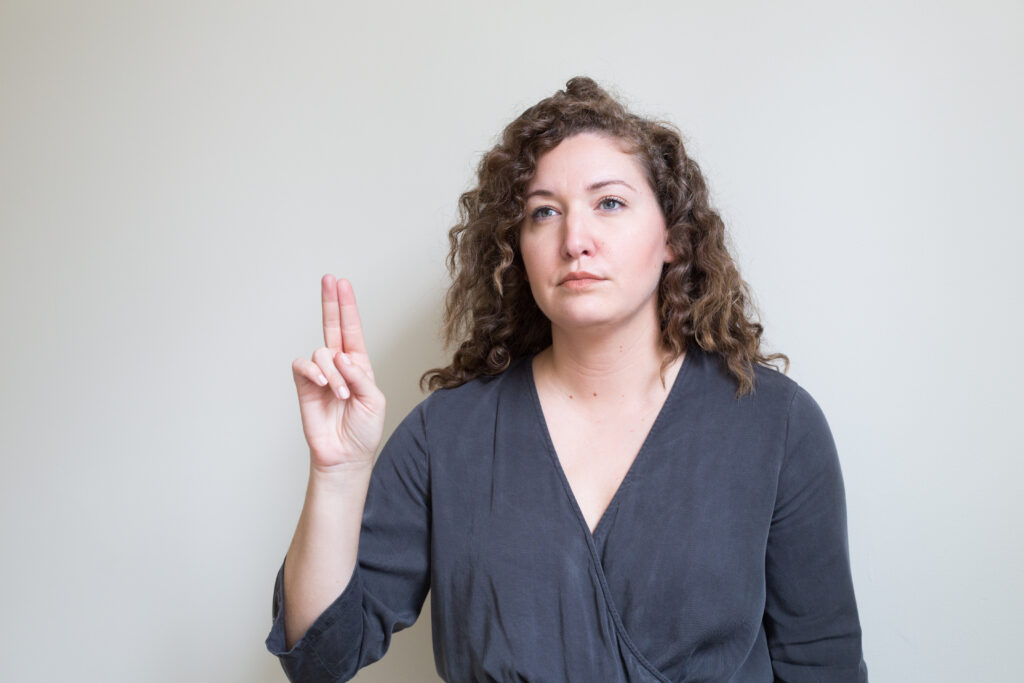 A photo of a caucasian woman demonstrating how EMDR uses eye movement. 