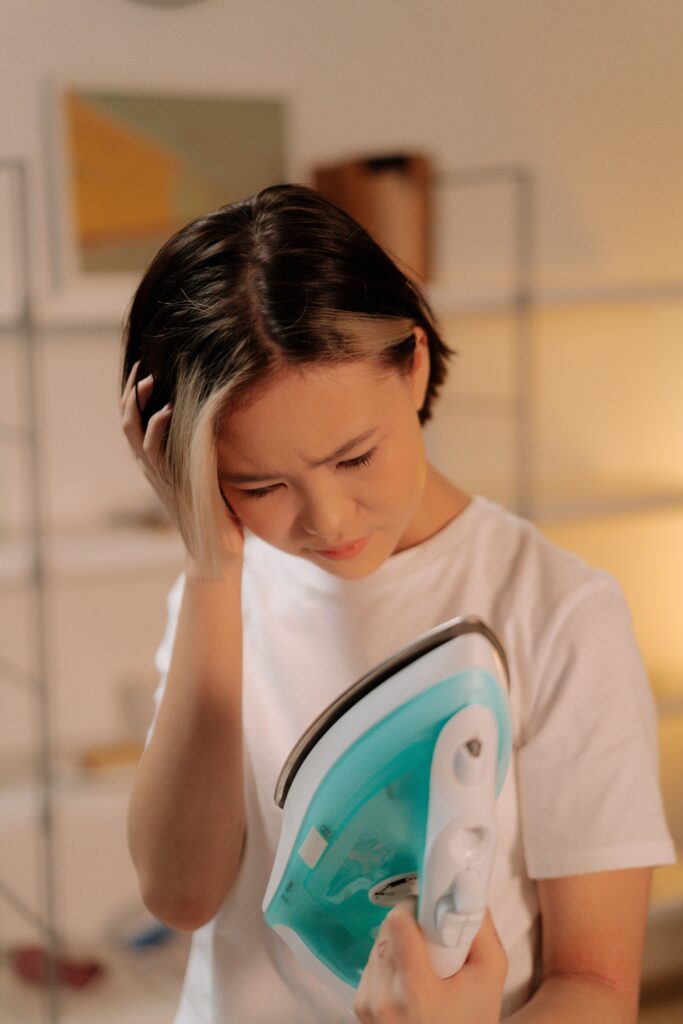 woman with OCD Checking, looking at her iron to see if it turned off
