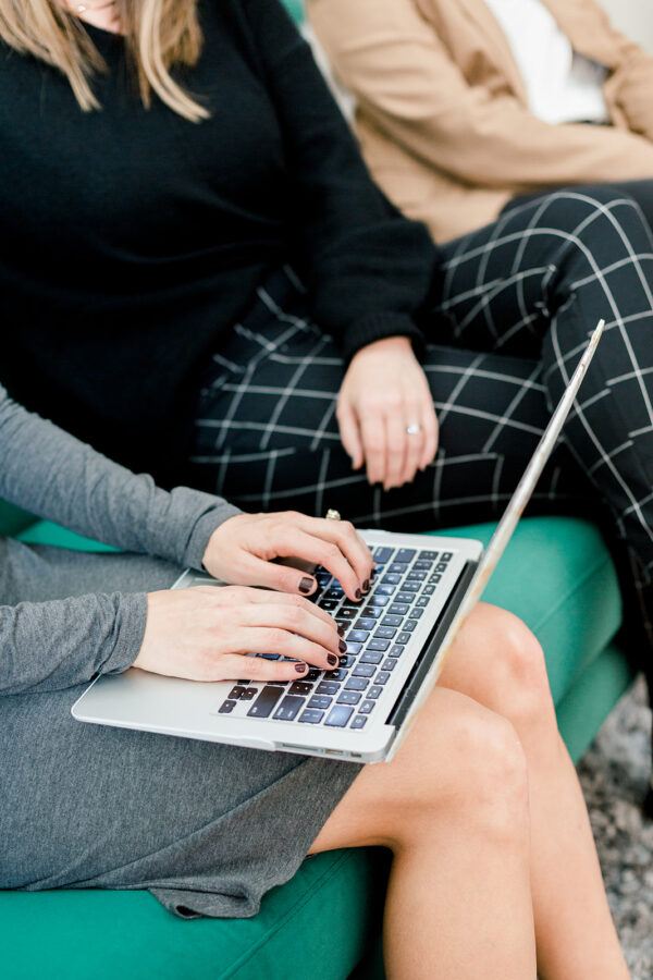 portrait of woman typing on laptop for teletherapy article