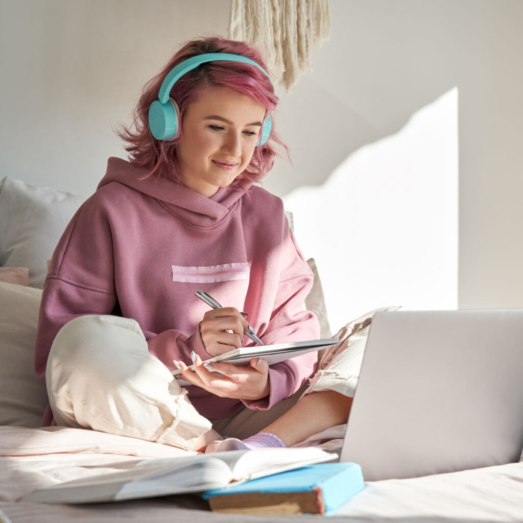 Teen with pink hair in therapy for teens virtually