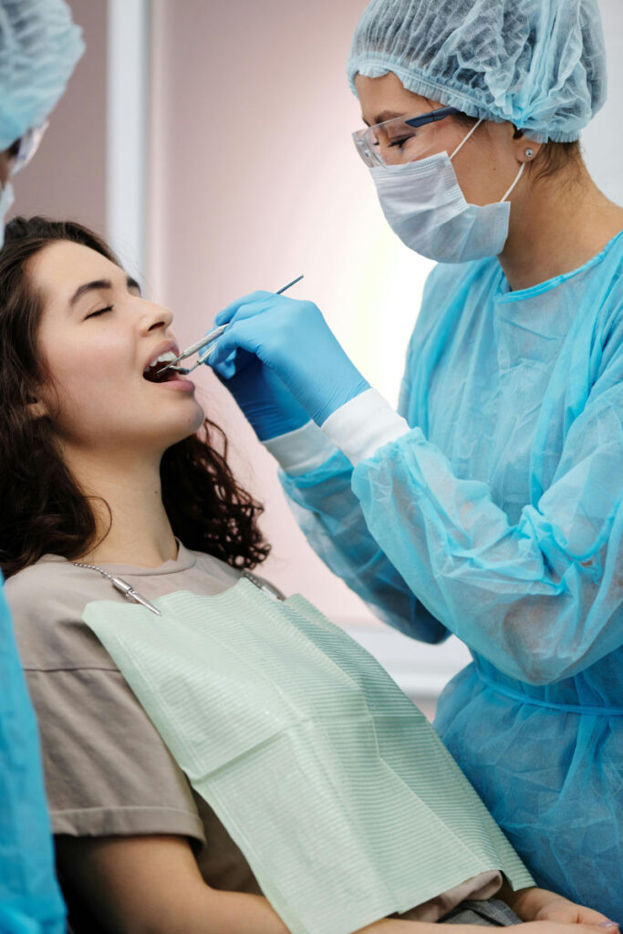 Dentist examining woman who has anxiety 