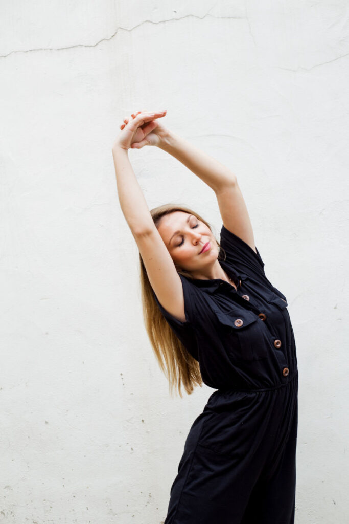 Woman practicing yoga for holiday stress relief
