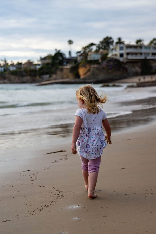 photo of child at beach for post on nurturing your inner child