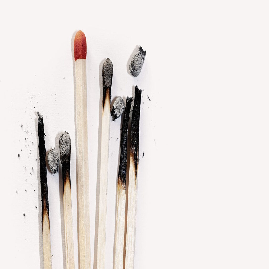 a set of burnt matches for article titled "what is burnout?"