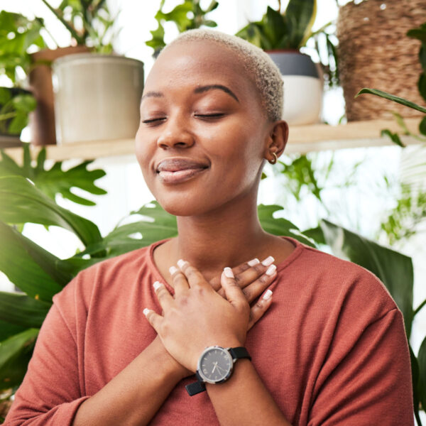 photo of woman with head on chest feeling peaceful in trauma therapy