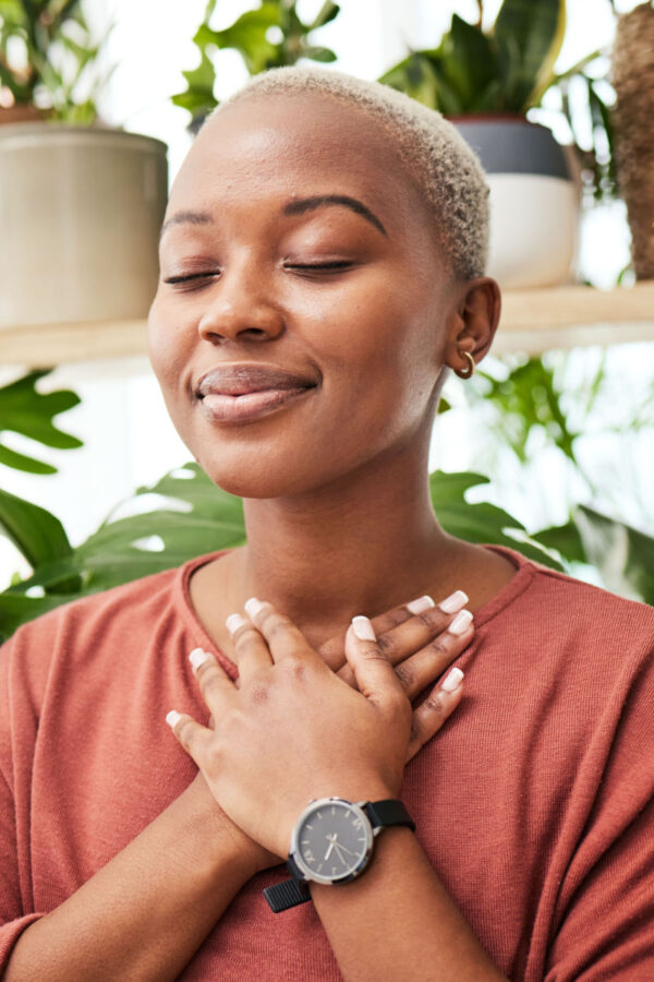 photo of woman with head on chest feeling peaceful in trauma therapy