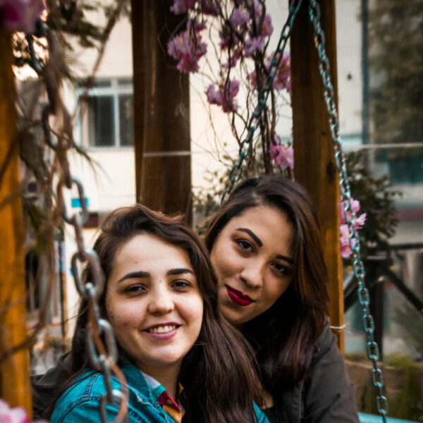 two women on swing set