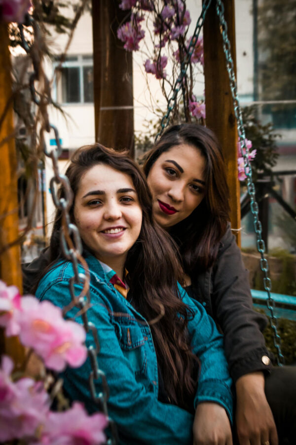 two women on swing set