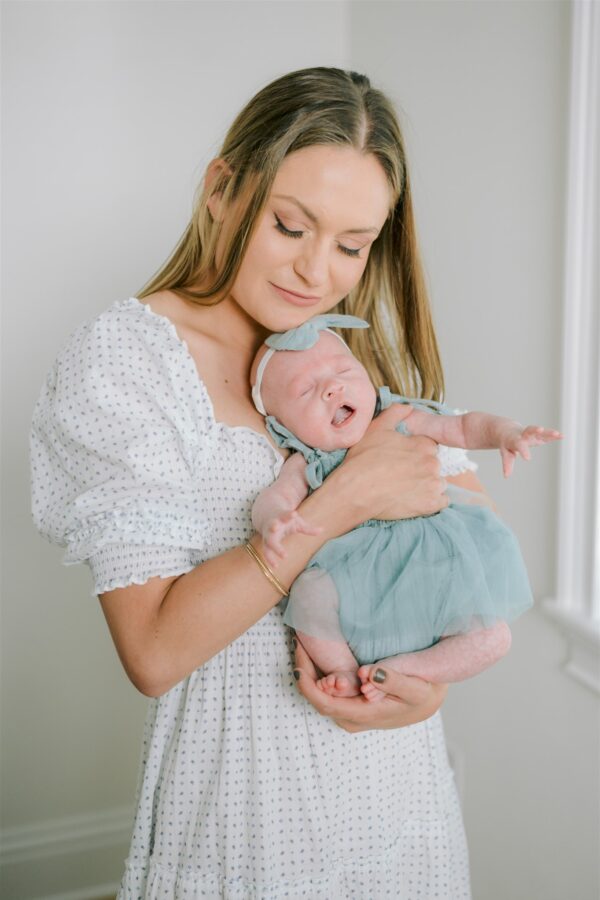 author with her newborn baby learning to manage overstimulation