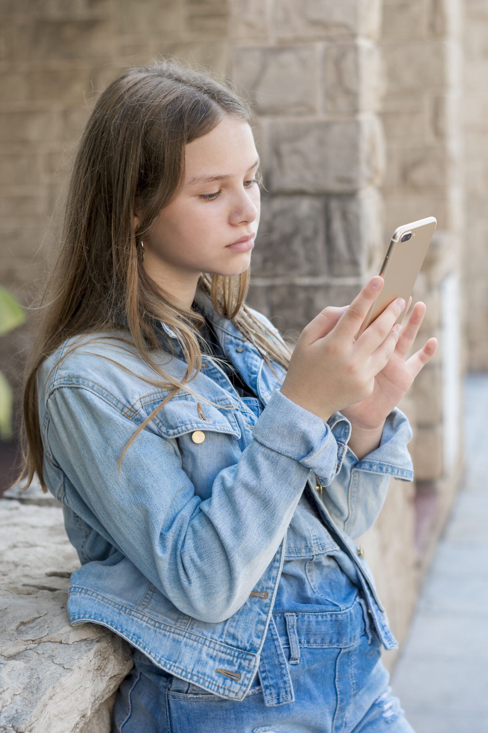 teen addicted to social media scrolling on phone