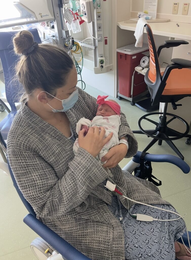 The author of this article in the NICU with her daughter, dealing with birth trauma
