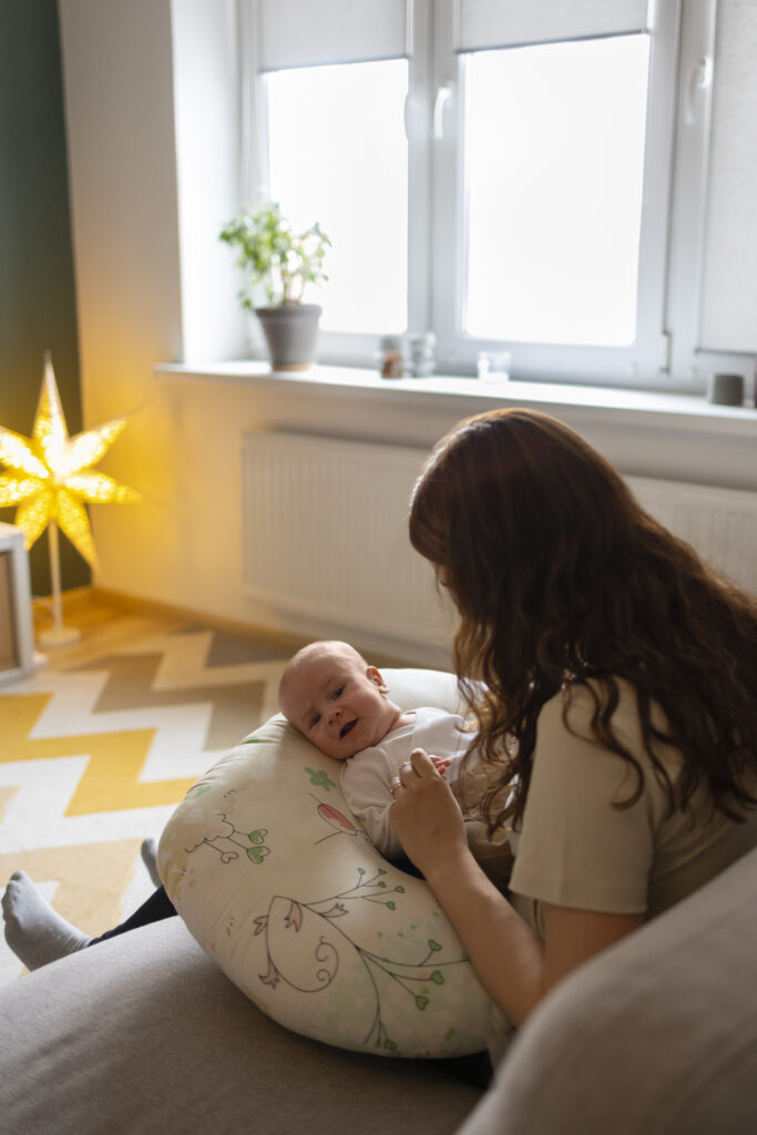 mother with baby attempting to heal after birth trauma
