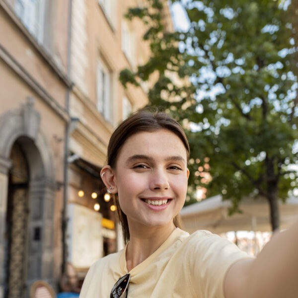 Selfie of woman in the sun on a patio