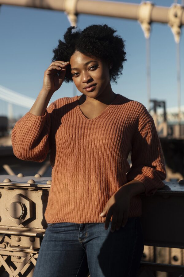 portrait of woman outside in sweater for article on REBT