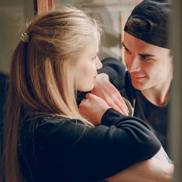 man and woman staring into each others eyes for article on love bombing