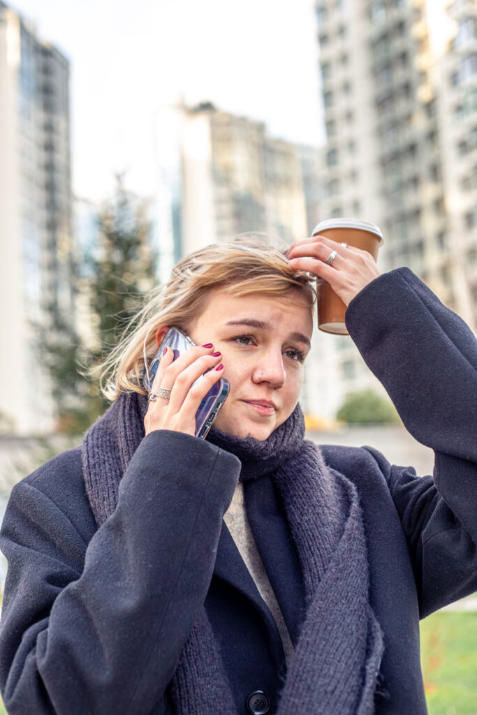 Woman on the phone making an appointment for therapy for anger