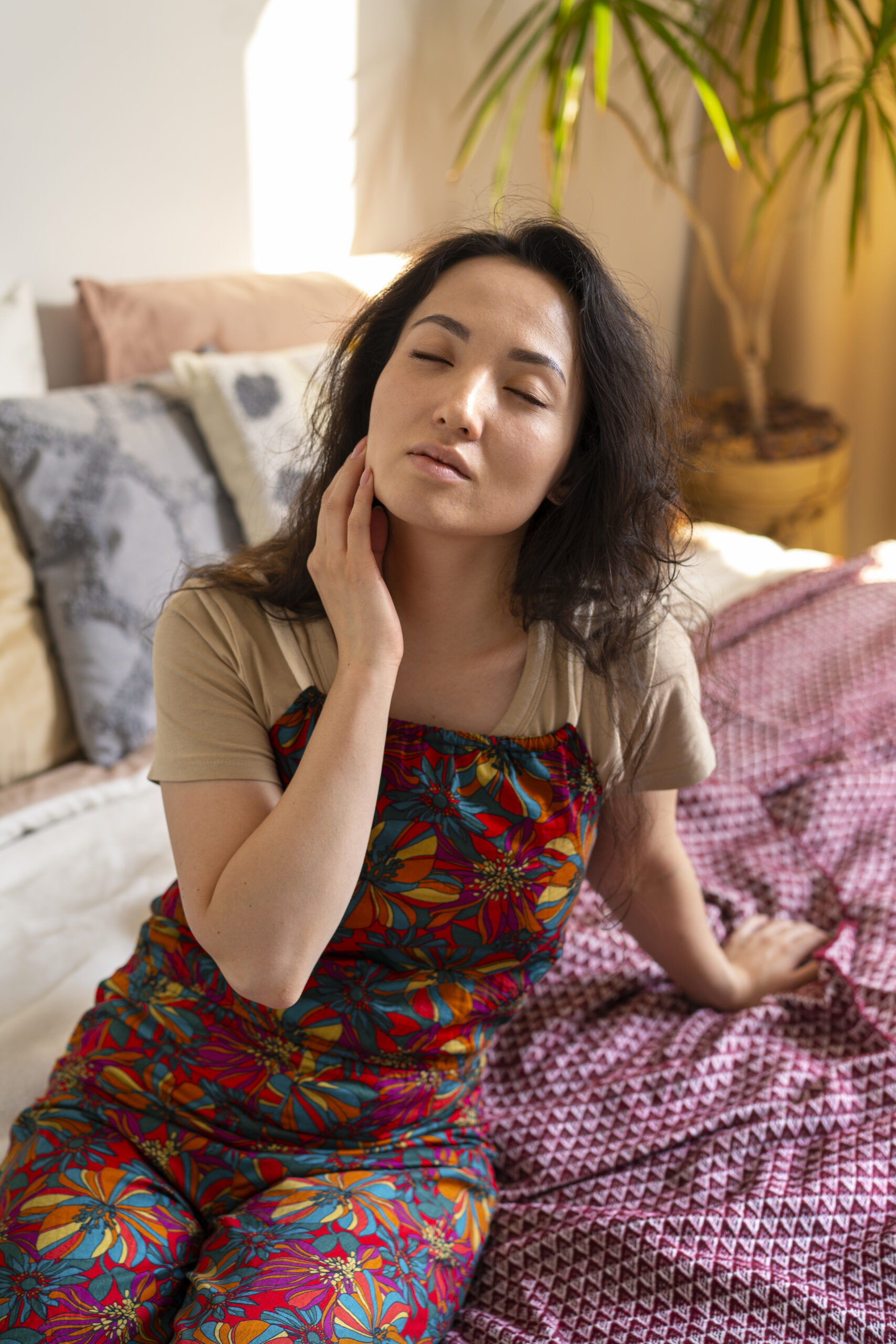 Woman sitting on her bed feeling emotional numbness