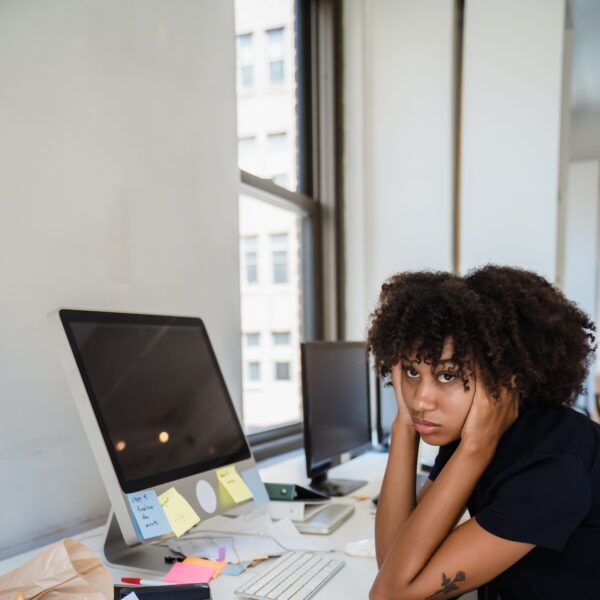 stock photo of woman at desk for article on how to know if you need a pyschiatrist for adhd evaluation