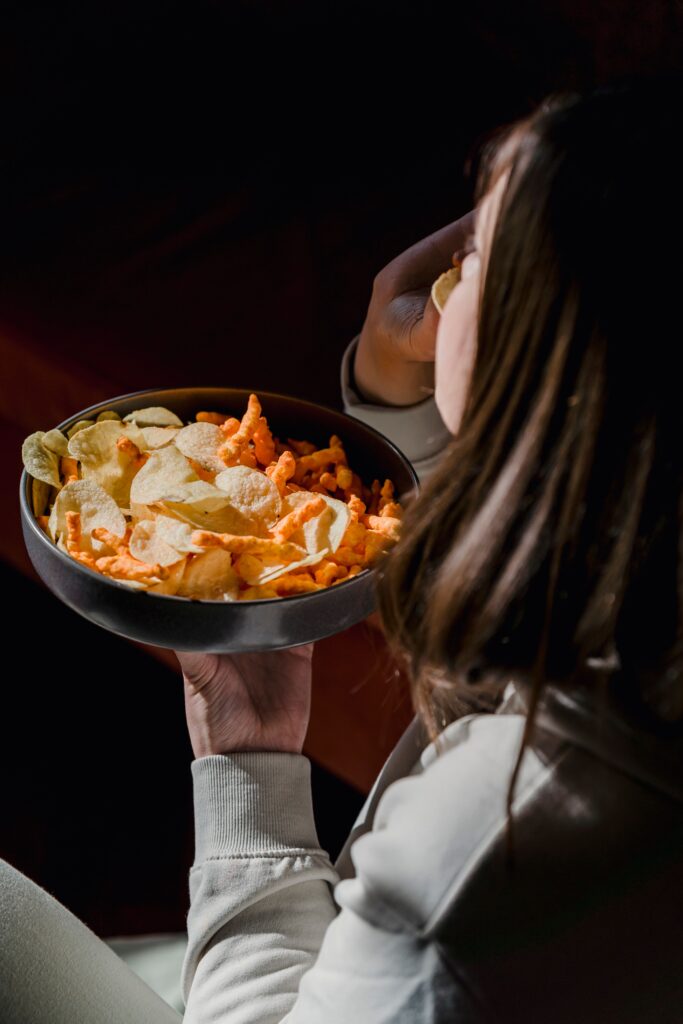 woman who is binge eating at night